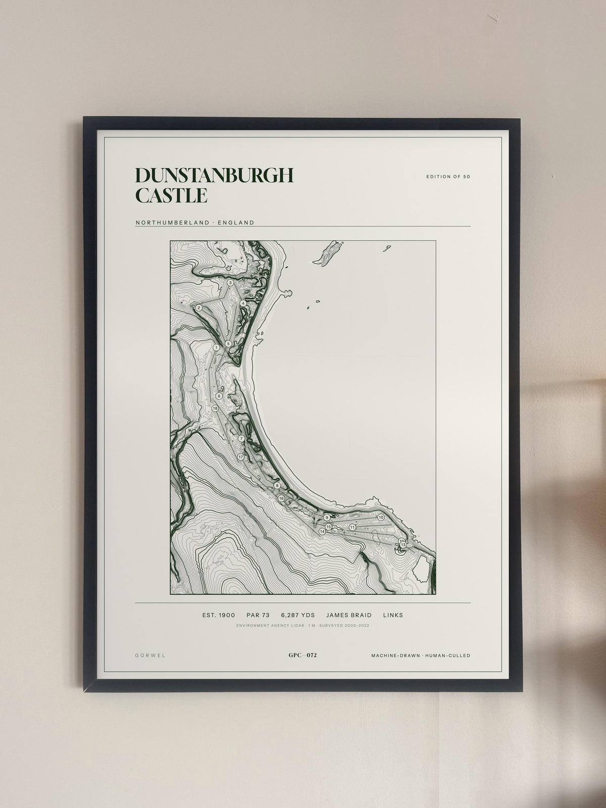 Dunstanburgh Castle topographic golf course print — framed on a wall — Gorwel Print Co