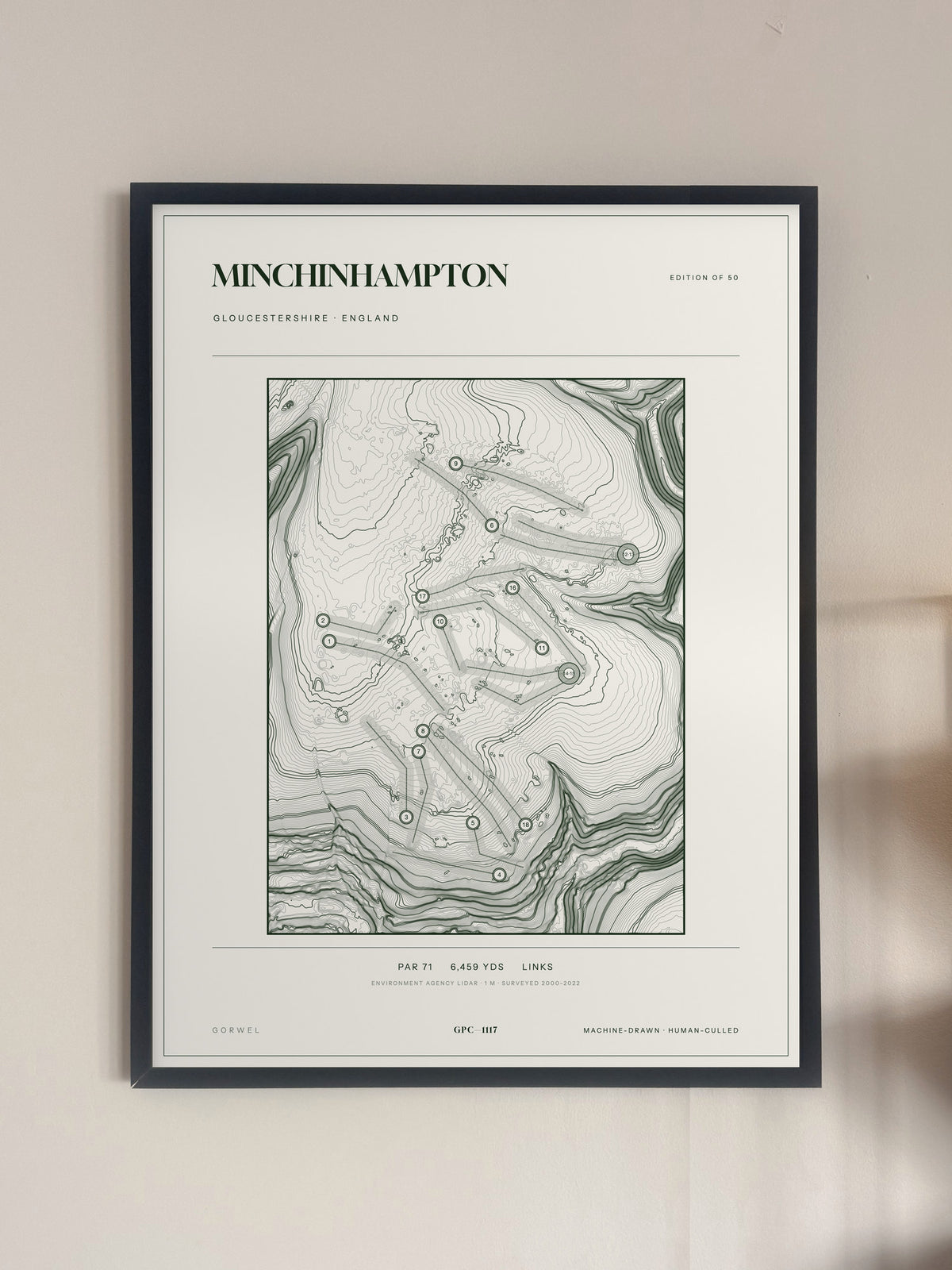 Minchinhampton, Gloucestershire print, framed, on a wall
